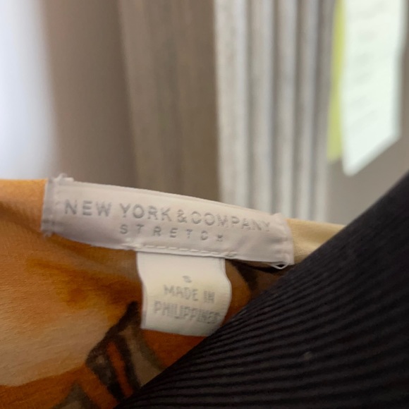 Fun Flirty and Flattering Faux Wrap Floral dress! Gently used. Only worn twice. - Picture 6 of 6